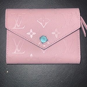 Louis Vuitton Zoé wallet in pink Monogram Empreinte leather